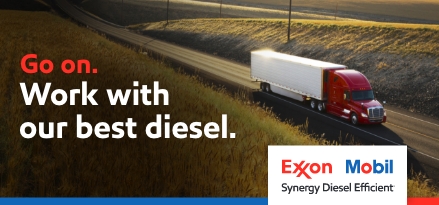 Heavy duty truck on open road. Go on. Work with our best diesel. Exxon Mobil Synergy Diesel Efficient logo