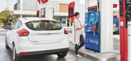 Woman at nearest gas station’s ExxonMobil Synergy pump