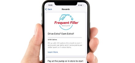 smart phone with Exxon Mobil Rewards+™ frequent filler gas app displayed.