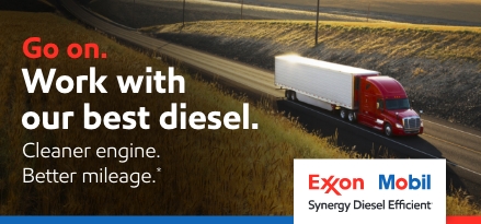 Heavy duty truck on open road. Go on. Work with our best diesel. Cleaner engine. Better mileage.* Exxon Mobil Synergy Diesel Efficient logo