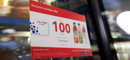 Exxon or Mobil convenience store offers in store on a drink cooler