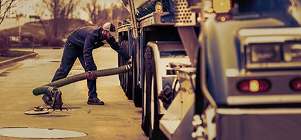 Man filling up gas truck